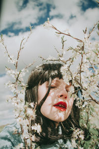 Portrait of woman against plants