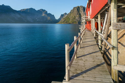 Pier amidst lake against sky