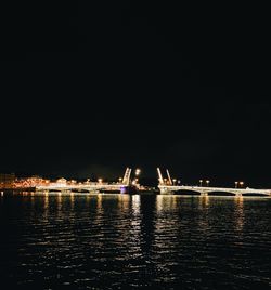 Scenic view of sea against clear sky at night