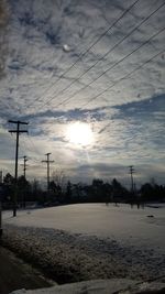 Scenic view of landscape against sky during winter