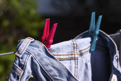 Close-up of clothespins on clothesline