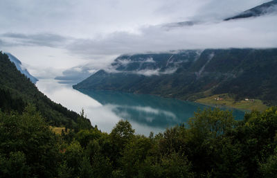 Scenic view of lake and mountains against sky