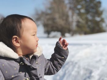 Close-up portrait of cute girl in winter