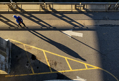 Lonely man walking into the sun