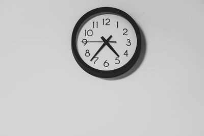 Close-up of clock on wall