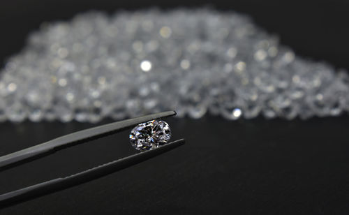 Close-up of wedding rings on table