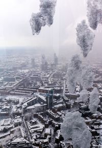 High angle view of city buildings during winter