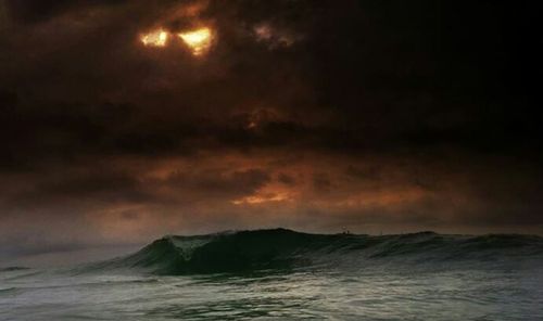 Scenic view of sea against sky at night