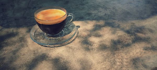 High angle view of coffee cup on table