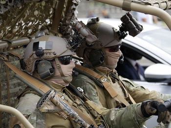 Close-up of army soldiers in car