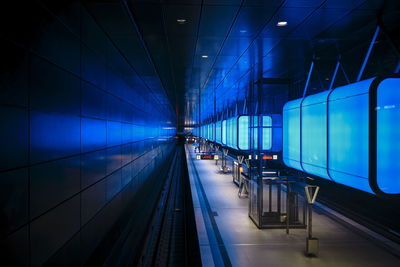 Train at illuminated subway station