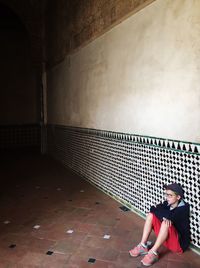 View of woman standing on wall