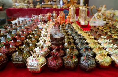 Row of pomegranate shaped incense burners for sale at the vernissage market in yerevan, armenia