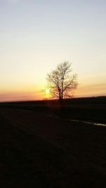 Scenic view of landscape against sky at sunset