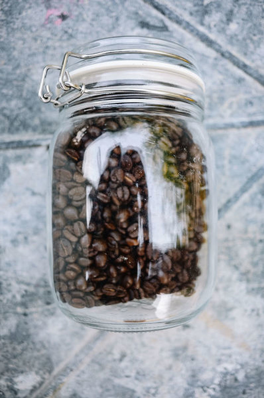 HIGH ANGLE VIEW OF COFFEE BEANS IN GLASS JAR