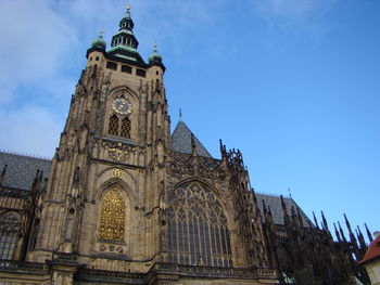 Low angle view of historical building against blue sky