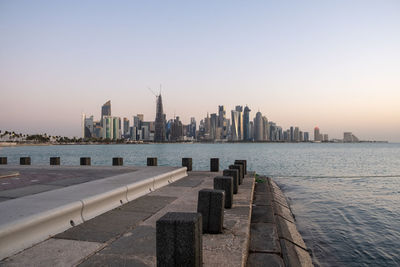 Modern buildings of doha, qatar against clear sky