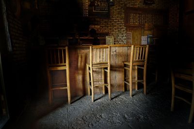 Empty chairs and tables in building