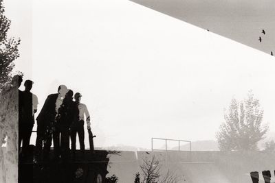 Low angle view of people's reflection