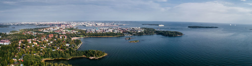 High angle view of sea and cityscape against sky