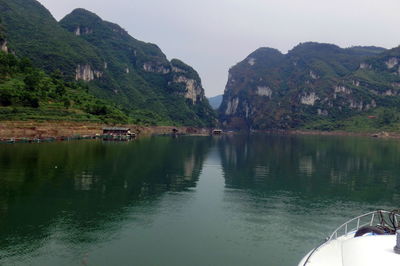 Scenic view of lake and mountains against sky