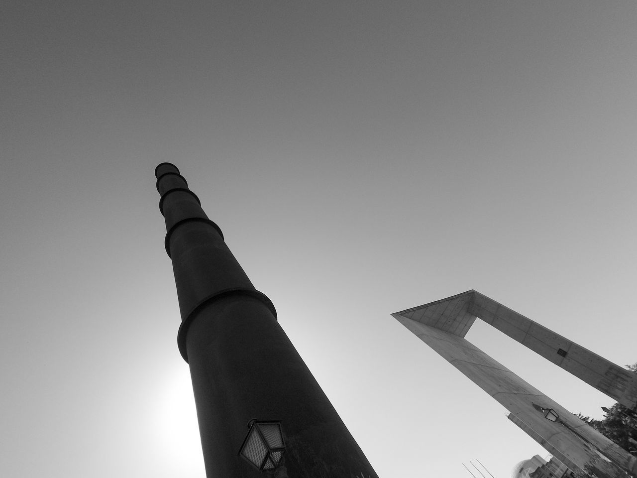 LOW ANGLE VIEW OF CROSS AGAINST BUILDING AGAINST CLEAR SKY