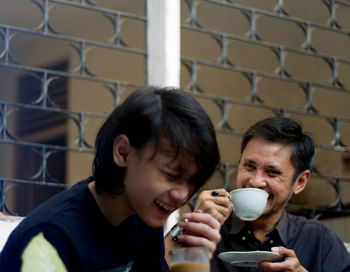 Portrait of man and coffee cup