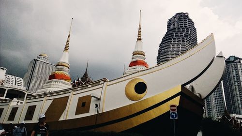 Low angle view of buildings in city against sky