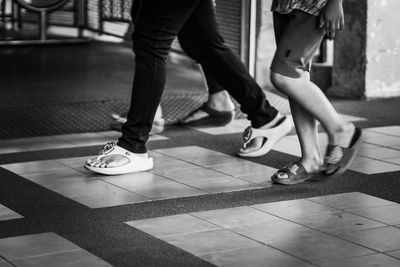 Low section of people standing on footpath