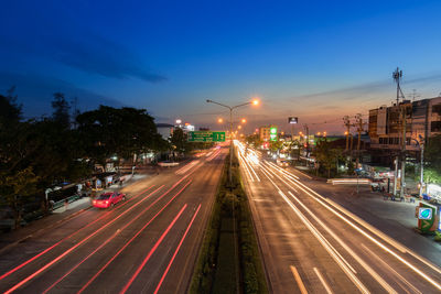 High angle view of light trails on road at night