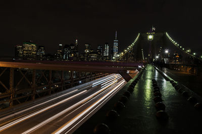 Light trails on road in city at night