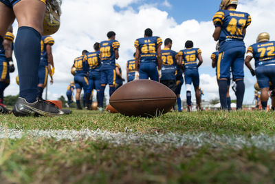 American football players are seen on the playing field at the armando oliveira stadium