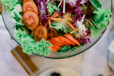 High angle view of chopped vegetables in bowl on table