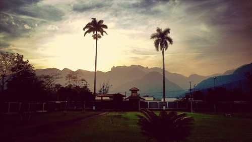 Scenic view of landscape against cloudy sky