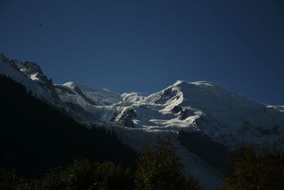 View of snowcapped mountain against blue sky