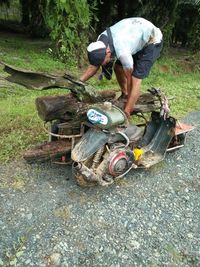 Rear view of man working on road