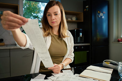 Portrait of young woman using mobile phone