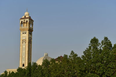 Low angle view of minaret against clear sky