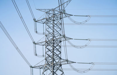 High voltage electric transmission tower. high voltage power lines against the sky. electricity 