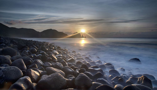 Scenic view of sea against sky during sunset