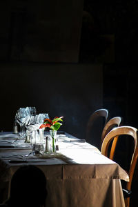 Empty chairs and tables in restaurant