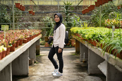 Full length portrait of young woman