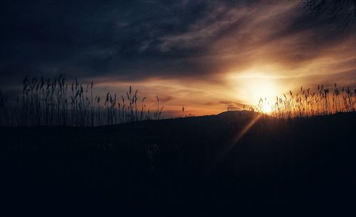 Scenic view of silhouette landscape against sky during sunset