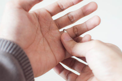 Close-up of hand holding hands