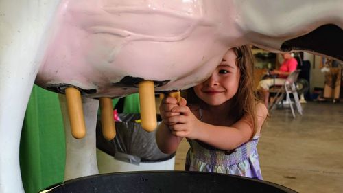 Smiling girl playing with toy 