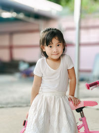 Portrait of cute girl standing outdoors