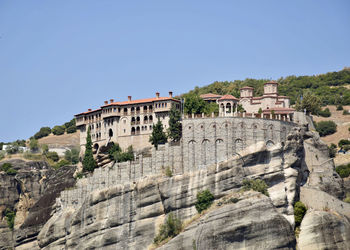 Built structure on mountain against clear sky