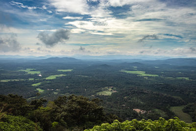 Mountain horizon coverd with cloud layers and forests