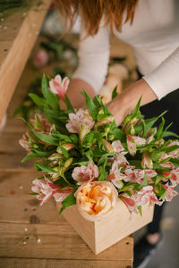 High angle view of woman holding rose bouquet