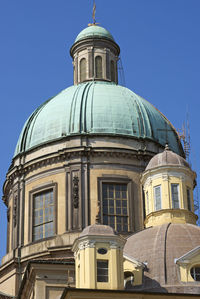 Low angle view of building against clear blue sky